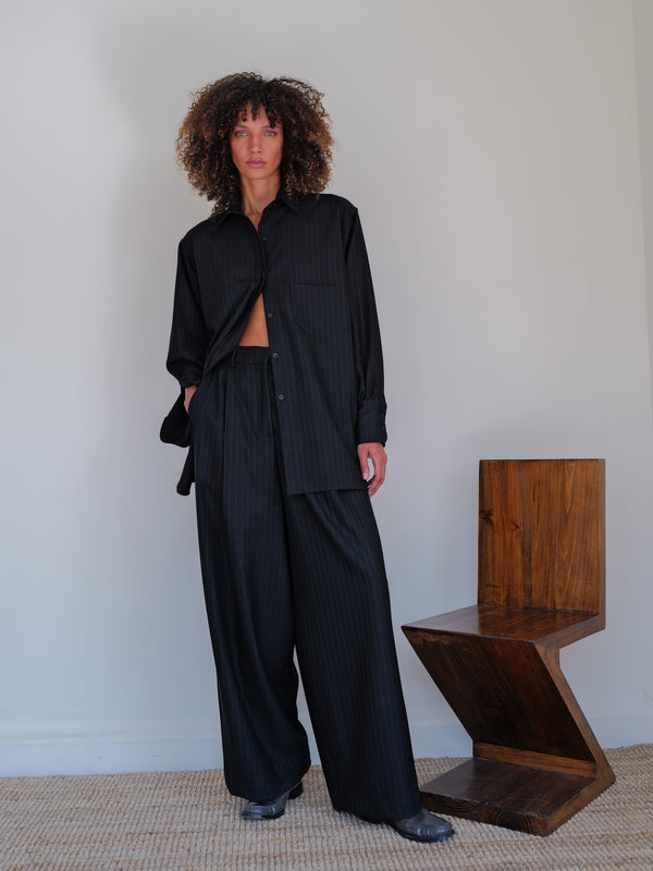 The Pinstripe Wool Wide Leg Pleated Trouser